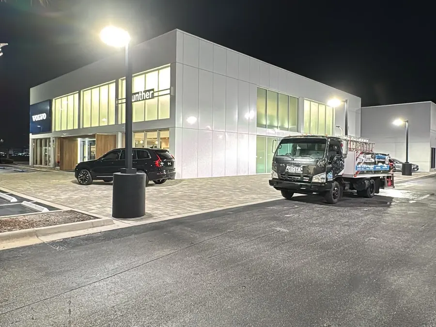 Costa's wash truck at a car dealership at night