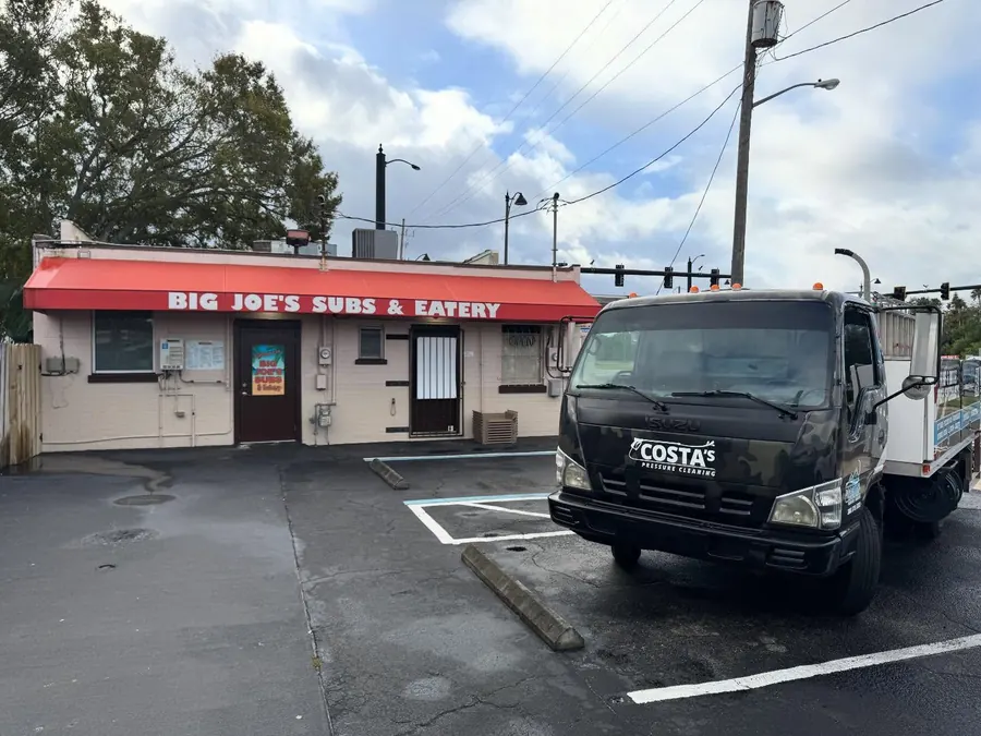 Costa's wash truck parked outside a sandwich shop in New Smyrna Beach