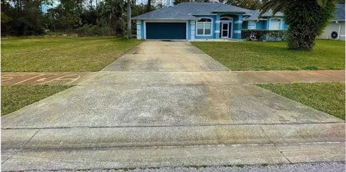 Before: long concrete driveway