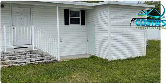 Before: white siding and entry steps