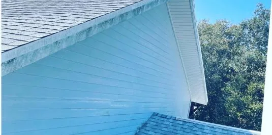 Before: siding and roof eaves