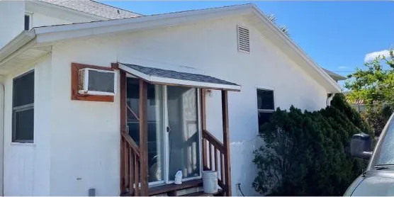 After: two-story home exterior, cleaned