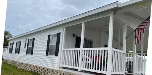 After: manufactured home with a front porch, cleaned