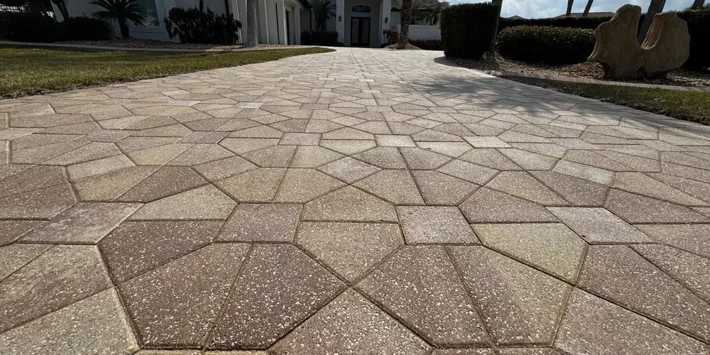 After: large paver driveway with a geometric pattern, cleaned