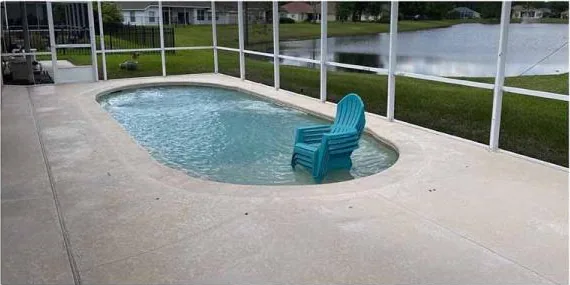 After: pool deck inside a screen enclosure, cleaned