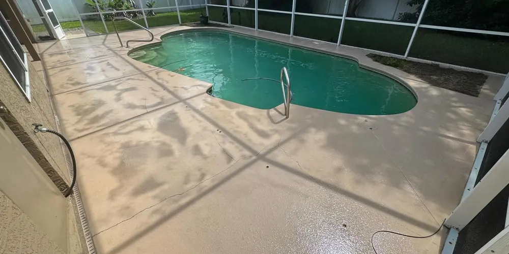 After: pool deck inside a screen enclosure, cleaned