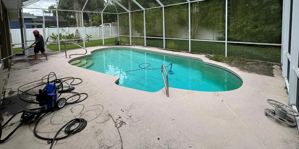 Before: pool deck inside a screen enclosure