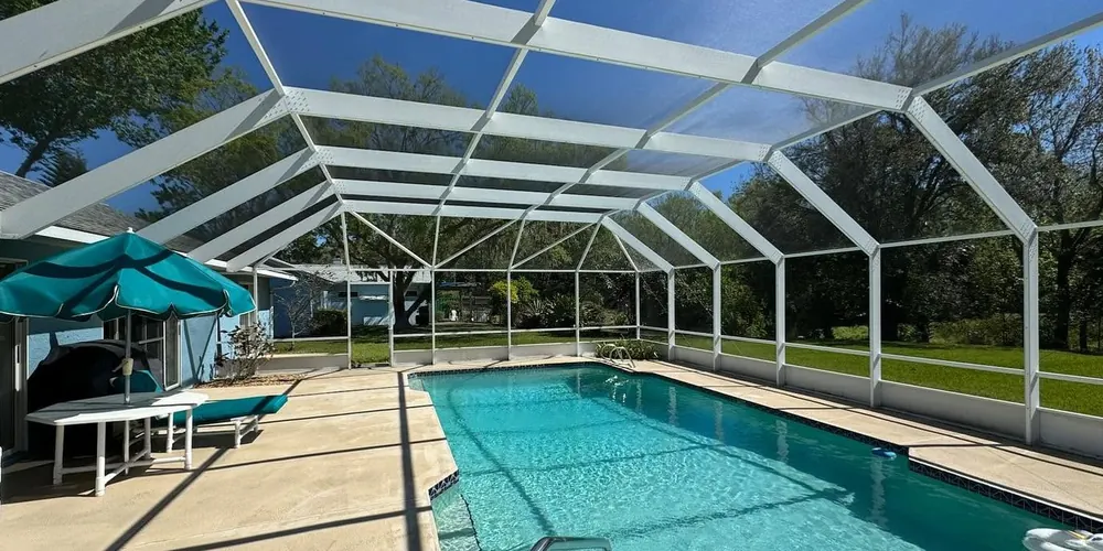 After: long screened pool enclosure, cleaned