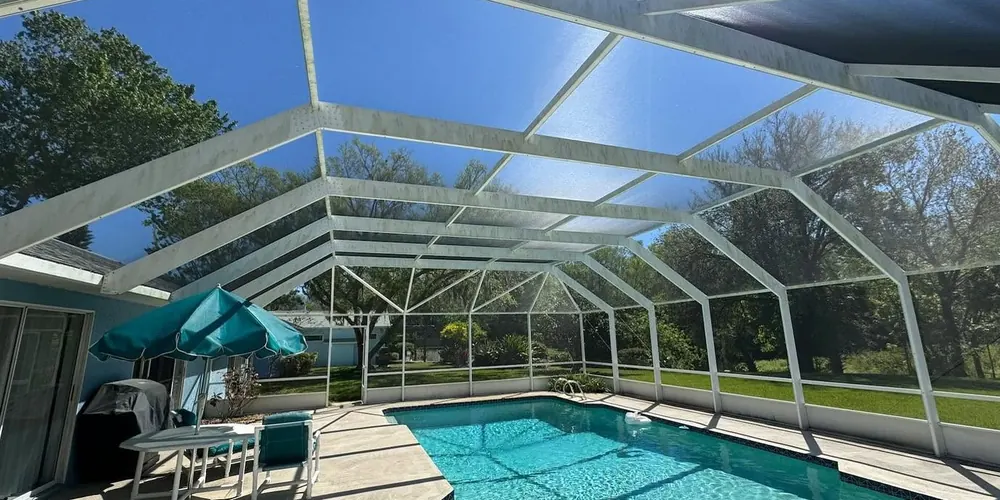 Before: long screened pool enclosure