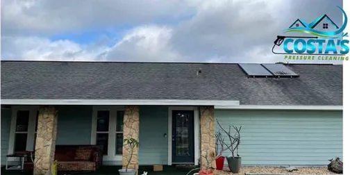 Before: home with a shingle roof and solar panels