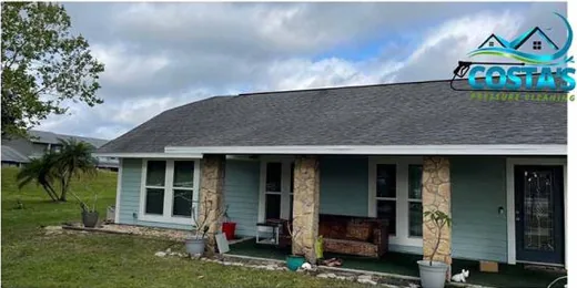 Before: front of a home with a shingle roof
