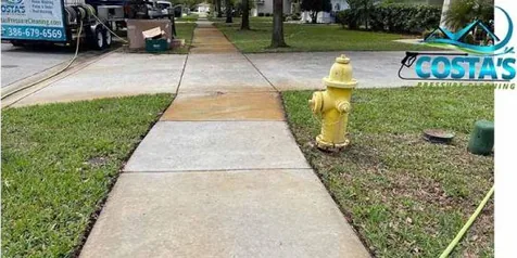 Before: stained sidewalk next to a fire hydrant